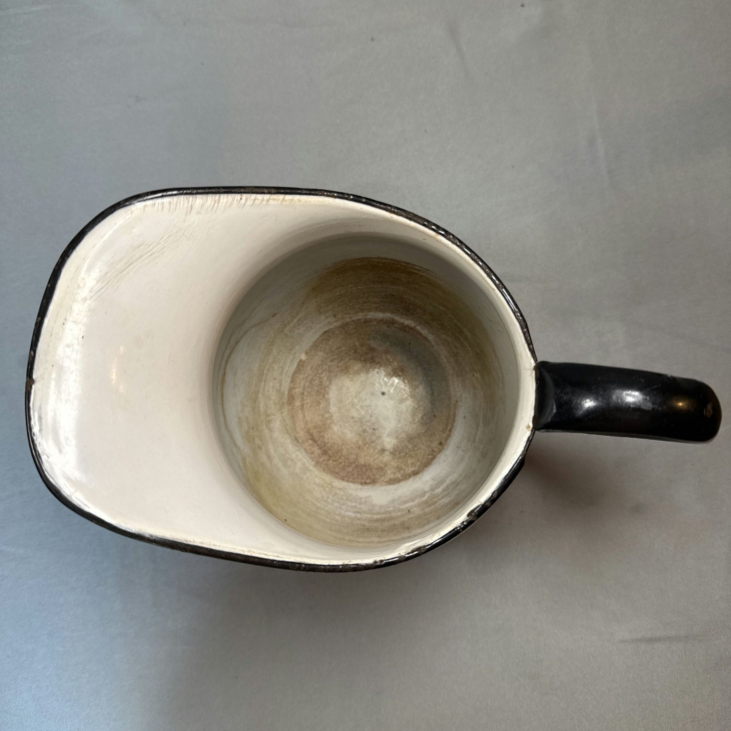 Antique White Enamelware Water Pitcher with Black Rim
